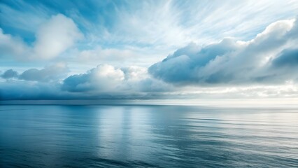 Obraz premium The Sea Horizon Merges Seamlessly Into Misty Silver Morning Clouds, Creating A Dreamlike Scene Where Ocean And Sky Blur Together In Serene Harmony And Ethereal Coastal Tranquility