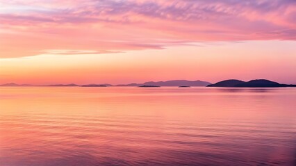 Fototapeta premium The Smooth Sea Surface Reflects A Soft Pink Dawn Above Distant Islands, Blending Gentle Light And Tranquil Waters Into A Peaceful Symphony Of Morning Calm And Natural Beauty