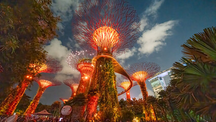 Singapore - September 13, 2023: Illuminated supertrees of Gardens by Bay nature park at night