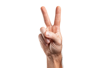 Hand makes peace sign with two fingers raised, isolated against a stark black background