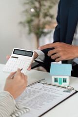 Real Estate Consultation. Financial advisor discussing property investment with client.