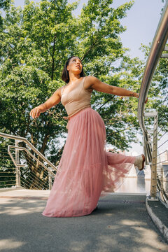 Dancer posing in urban park showing freedom and creativity