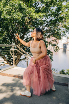 Woman performing modern dance outdoors in urban setting