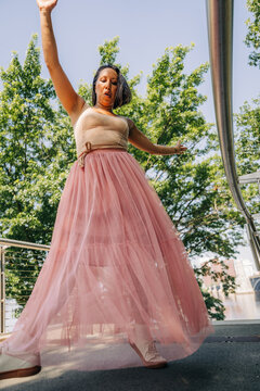 Female dancer gracefully performing in urban park