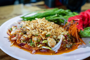 Spicy Thai Raw Oyster Salad (Yum Hoi Nang Rom) Topped with Crispy Fried Onions