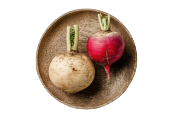 Overhead shot shows two radishes, one white, one red, presented on a rustic wooden plate