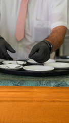 Making a perfect coffee cup with crema in a busy bar setting by skilled barista