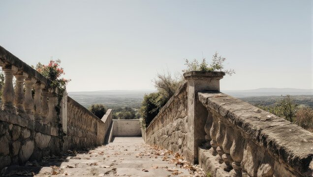 Stone pathway with balustrades leading to a distant view.