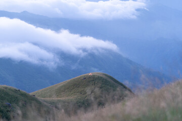 A tent in top of mountain with Mountain Range view point in Myanmar (Burma) with sea of cloud (Mulayit Taung) and sunrise
