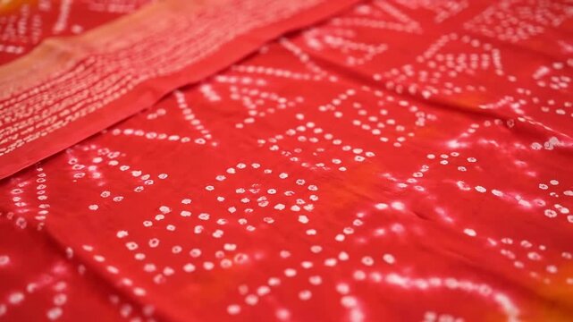 Elegant Red Bandhani Saree Fabric with Intricate White Dot Patterns for Festive Occasions and Traditional Indian Fashion