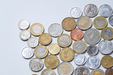 Coins from various countries isolated on white background