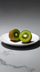 Kiwi Fruit Halves on White Plate - Fresh and Healthy.