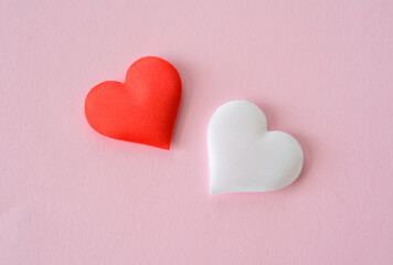 Red and White Hearts on Pink Background close up