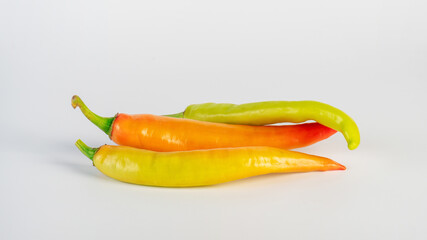 Orange sweet pepper on white background