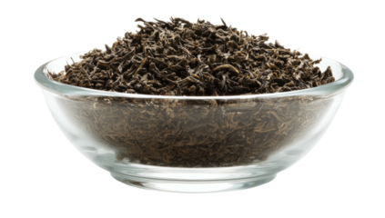 Close-up shot of dried, loose tea leaves filling a clear, transparent glass bowl, isolated on black