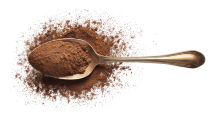 An overhead shot showcases a silver spoon overflowing with brown powder. The powder spills onto a surface