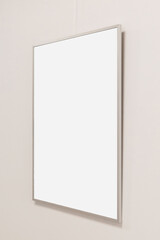 A blank picture frame is mounted on a light-colored wall, creating a minimalist ambiance.