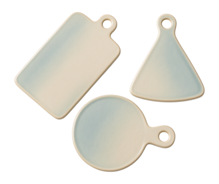 Ceramic cheese boards in assorted shapes, perfect for themed platters at home events.