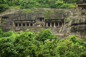 Fototapeta premium The bas-reliefs of Buddha carved into the cliff face of the Ajanta Caves, considered to be the most beautiful and oldest Buddhist cave temples in the world, were built in 350 AD.