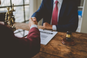 Lawyers shaking hands completing legal contract agreement