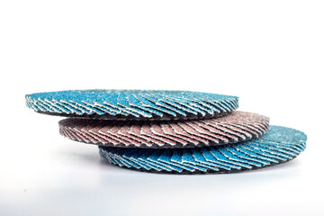 abrasive flap discs for metal grinding and surface finishing, arranged on a white background. Ideal for industrial design, tool catalogs, manufacturing process visuals, or workshop equipment themes