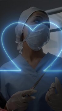 Animation of heart rate monitor against team of diverse surgeons performing surgery at hospital