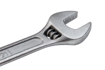 A close-up studio shot presents a metallic adjustable wrench against a stark black background