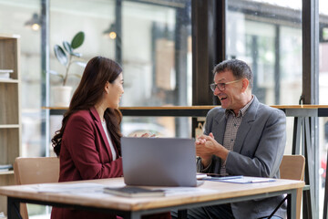 Business people engaging in lively office discussion