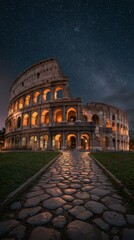 Naklejka premium Illuminated ancient amphitheater in the evening, starry sky above, pathway leading to the entrance.