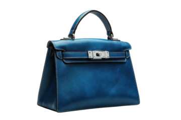 Elegant blue leather handbag with silver hardware perfect for fashion accessories and luxury style trends on transparent background