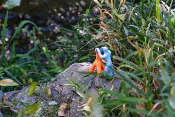 Handmade Plasticine Photographer Silhouette with Tripod in Natural Surroundings, Soft Focus Artistic Image