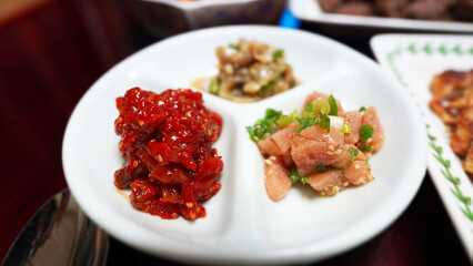Traditional Korean Side Dishes, Spicy Squid Jeotgal and Seasoned Pollock Roe, Myunran Jeot