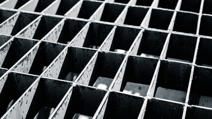 Close up metal grid texture industrial background in black and white