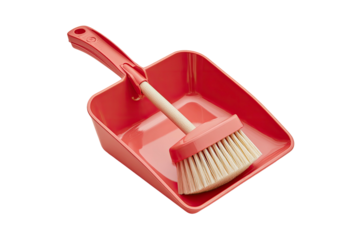A red cleaning brush and dustpan, used for tidying and sweeping dirt, on a black background