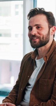 Man, talk or smile in meeting with counseling for mental health support, sharing story or healing. Happy, employee or people in office with discussion for psychology, therapy session or EAP workshop.