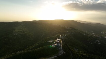 Sighnaghi, Georgia - July 15 2025: Aerial view of modern hilltop hotel Bodbe. Complex with Pool Terrace Overlooking Lush Green Valleys and Distant Horizon over Sighnaghi city