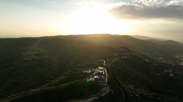 Sighnaghi, Georgia - July 15 2025: Aerial view of modern hilltop hotel Bodbe. Complex with Pool Terrace Overlooking Lush Green Valleys and Distant Horizon over Sighnaghi city