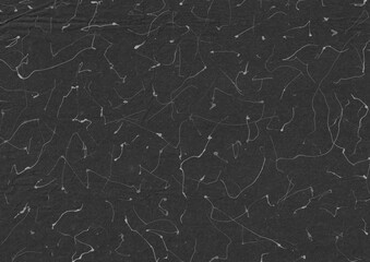 Abstract white scribble on dark paper background. Grunge and aged surface graphic element.