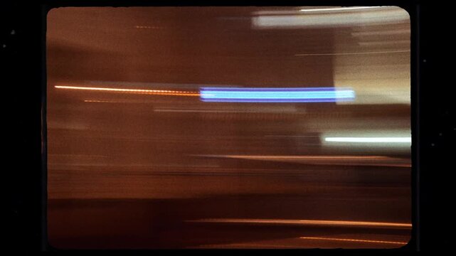 Vintage super 8 film city light trails at night