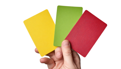 A hand displays a fan of three brightly colored cards; yellow, green, and red, against black