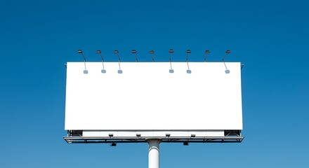 Obraz premium Blank billboard against clear blue sky ideal for advertising and promotion