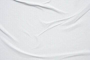white crumpled and creased glued wrinkled paper poster texture background