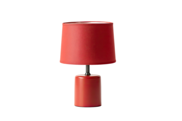 A small, modern table lamp with a red shade and base against a stark black background