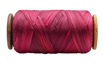 Spool of vibrant pink thread on a wooden bobbin for sewing and crafting projects close up studio shot on transparent background