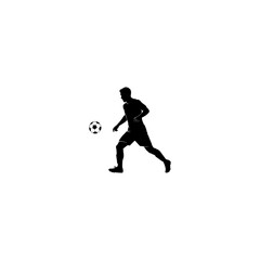 Obraz premium Silhouette of a soccer player kicking a ball in motion.