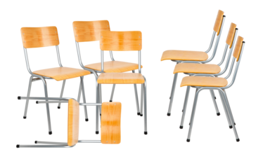 group of light wooden plywood and gray metal framed institutional chairs, commonly found in schools or halls, isolated on black.