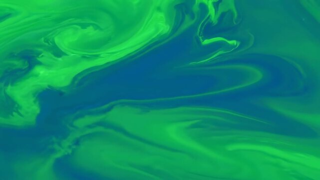 Abstract Fluidity: An artistic display of emerald green and sapphire blue hues blending in a fluid dance, creating an image of abstract energy and motion. 