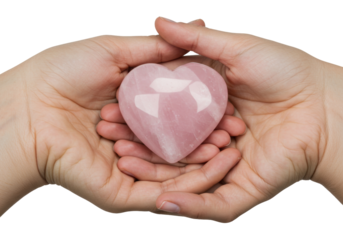 Isolated closeup of hands holding pink gemstone heart love, care, romance and relationships