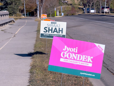 Calgary, Alberta, Canada. Oct 16, 2025. Political campaign signs for "Jyoti Gondek for Calgary's Mayor" and "Siraaj Shah Ward 3 Councillor" line a roadside, reflecting local elections.