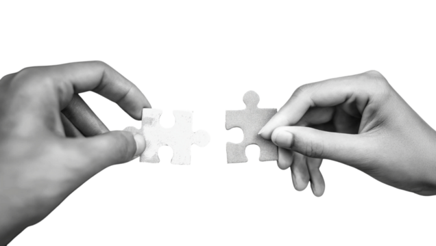 Hands holding puzzle pieces together isolated on a transparent background